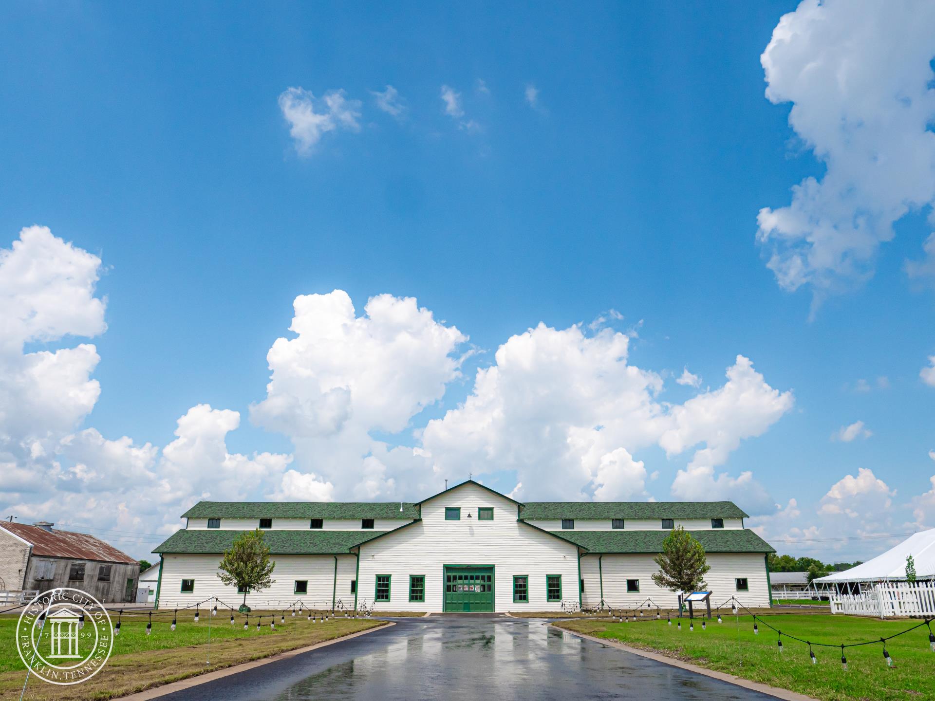 The iconic green-roofed white barn at Harlinsdale Farm in Franklin, Tennessee